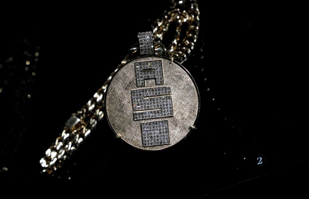 Nipsey Hussle's "All Money In A$I" necklace is displayed during a press preview May 8, 2024 in New York for "Ice Cold: An Exhibition of Hip-Hop Jewelry" at the American Museum of Natural History. (Photo by TIMOTHY A. CLARY / AFP) (Photo by TIMOTHY A. CLARY/AFP via Getty Images) ** OUTS - ELSENT, FPG, CM - OUTS * NM, PH, VA if sourced by CT, LA or MoD **