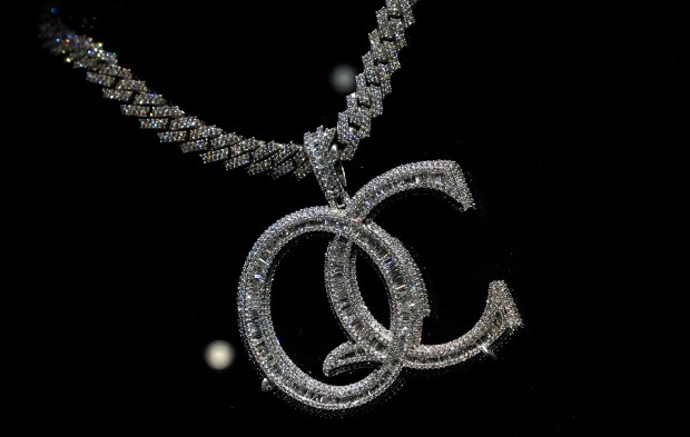 Coach K's QC necklace is displayed during a press preview May 8, 2024 in New York for "Ice Cold: An Exhibition of Hip-Hop Jewelry" at the American Museum of Natural History. (Photo by TIMOTHY A. CLARY / AFP) (Photo by TIMOTHY A. CLARY/AFP via Getty Images) ** OUTS - ELSENT, FPG, CM - OUTS * NM, PH, VA if sourced by CT, LA or MoD **
