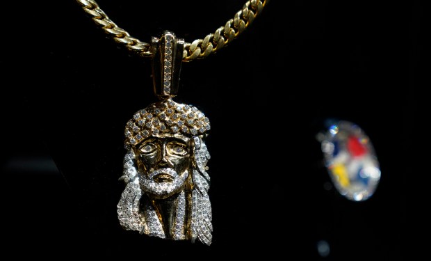 The Notorious B.I.G./Biggie Smalls, Jesus Piece Necklace is displayed during a press preview May 8, 2024 in New York for "Ice Cold: An Exhibition of Hip-Hop Jewelry" at the American Museum of Natural History. (Photo by TIMOTHY A. CLARY / AFP) (Photo by TIMOTHY A. CLARY/AFP via Getty Images) ** OUTS - ELSENT, FPG, CM - OUTS * NM, PH, VA if sourced by CT, LA or MoD **