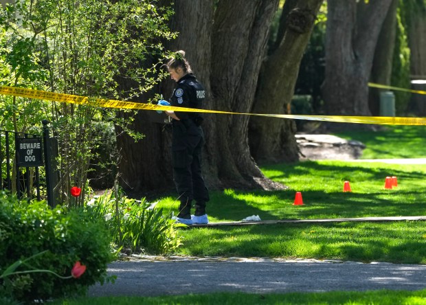Toronto Police investigate a shooting outside the mansion of rapper Drake in Toronto's Bridle Path neighborhood, Tuesday, May 7, 2024. Paramedics said a security guard working outside the home was taken to hospital with serious but non-life-threatening injuries in an overnight shooting. (Nathan Denette/The Canadian Press via AP)