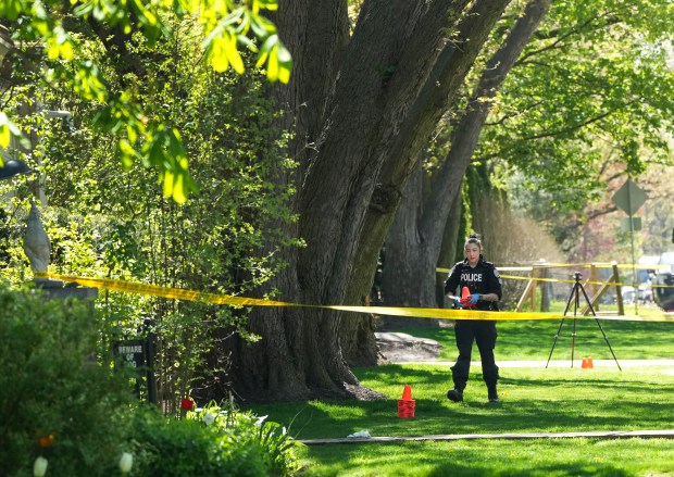 Toronto Police investigate a shooting outside the mansion of rapper Drake in Toronto's Bridle Path neighborhood, Tuesday, May 7, 2024. Paramedics said a security guard working outside the home was taken to hospital with serious but non-life-threatening injuries in an overnight shooting. (Nathan Denette/The Canadian Press via AP)