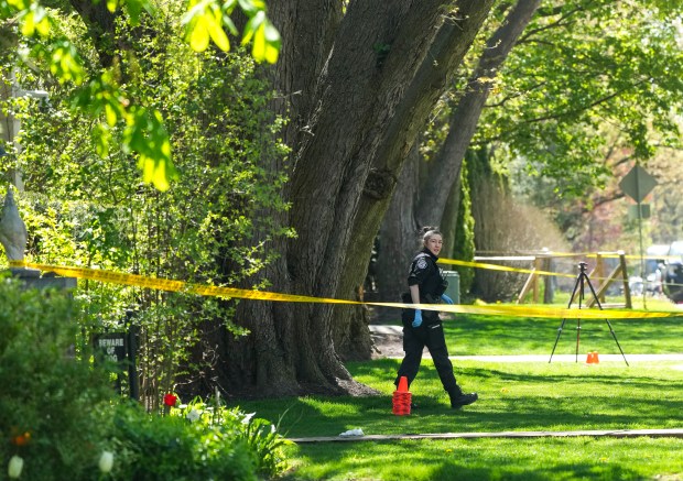 Toronto Police investigate a shooting outside the mansion of rapper Drake in Toronto's Bridle Path neighborhood, Tuesday, May 7, 2024. Paramedics said a security guard working outside the home was taken to hospital with serious but non-life-threatening injuries in an overnight shooting. (Nathan Denette/The Canadian Press via AP)