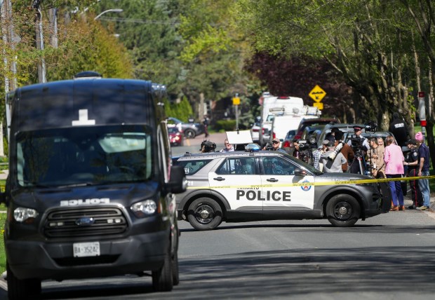 Media wait for a press conference as Toronto Police investigate a shooting outside rap mogul Drake's mansion in Toronto's Bridle Path neighborhood, Tuesday, May 7, 2024. Paramedics said a security guard working outside the home was taken to hospital with serious but non-life-threatening injuries in an overnight shooting. (Nathan Denette/The Canadian Press via AP)