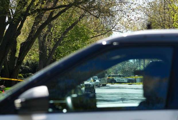 Toronto Police investigate a shooting outside the mansion of rapper Drake in Toronto's Bridle Path neighborhood, Tuesday, May 7, 2024. Paramedics said a security guard working outside the home was taken to hospital with serious but non-life-threatening injuries in an overnight shooting. (Nathan Denette/The Canadian Press via AP)