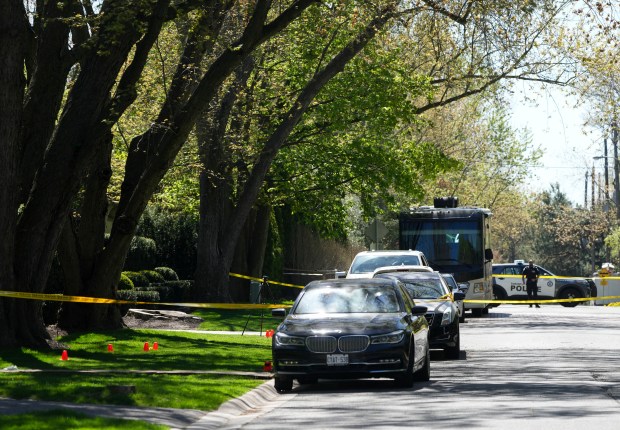 Toronto Police investigate a shooting outside the mansion of rapper Drake in Toronto's Bridle Path neighborhood, Tuesday, May 7, 2024. Paramedics said a security guard working outside the home was taken to hospital with serious but non-life-threatening injuries in an overnight shooting. (Nathan Denette/The Canadian Press via AP)