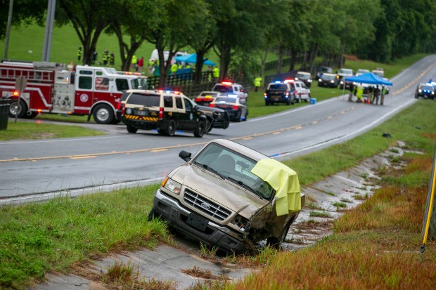 Emergency personnel respond to the scene of a deadly crash on Tuesday, May 14, 2024 near Dunnellon, Fla. The Florida Highway Patrol says a bus carrying farmworkers in central Florida has overturned, killing several people and injuring other passengers. (AP Photo/Alan Youngblood)