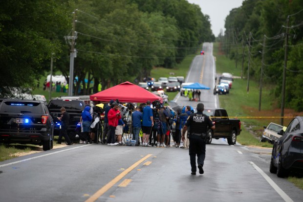 Emergency personnel respond to the scene of a deadly crash on Tuesday, May 14, 2024 near Dunnellon, Fla. The Florida Highway Patrol says a bus carrying farmworkers in central Florida has overturned, killing several people and injuring other passengers. (AP Photo/Alan Youngblood)