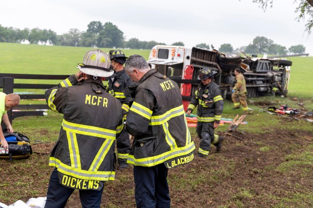 This photo provided by the Marion County Fire Rescue Dept. shows crews from Marion County Fire Rescue and the Marion County Sheriff's Office assisting victims after a bus carrying farmworkers crashed and overturned early Tuesday, May 14, 2024 near Ocala, Fla. The Florida Highway Patrol says eight people were killed and nearly 40 others were injured. (Marion County Fire Rescue Dept. via AP)
