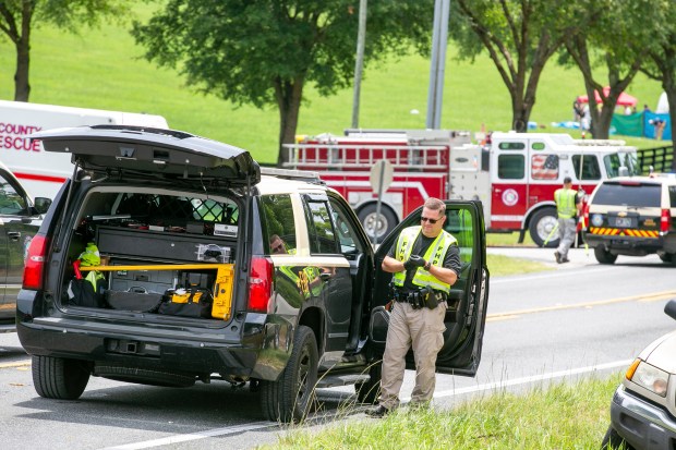 Police work at the scene of a deadly crash after a bus carrying farmworkers collided with a pickup truck on State Road 40 Tuesday, May 14, 2024, near Dunnellon, Fla. (AP Photo/Alan Youngblood)