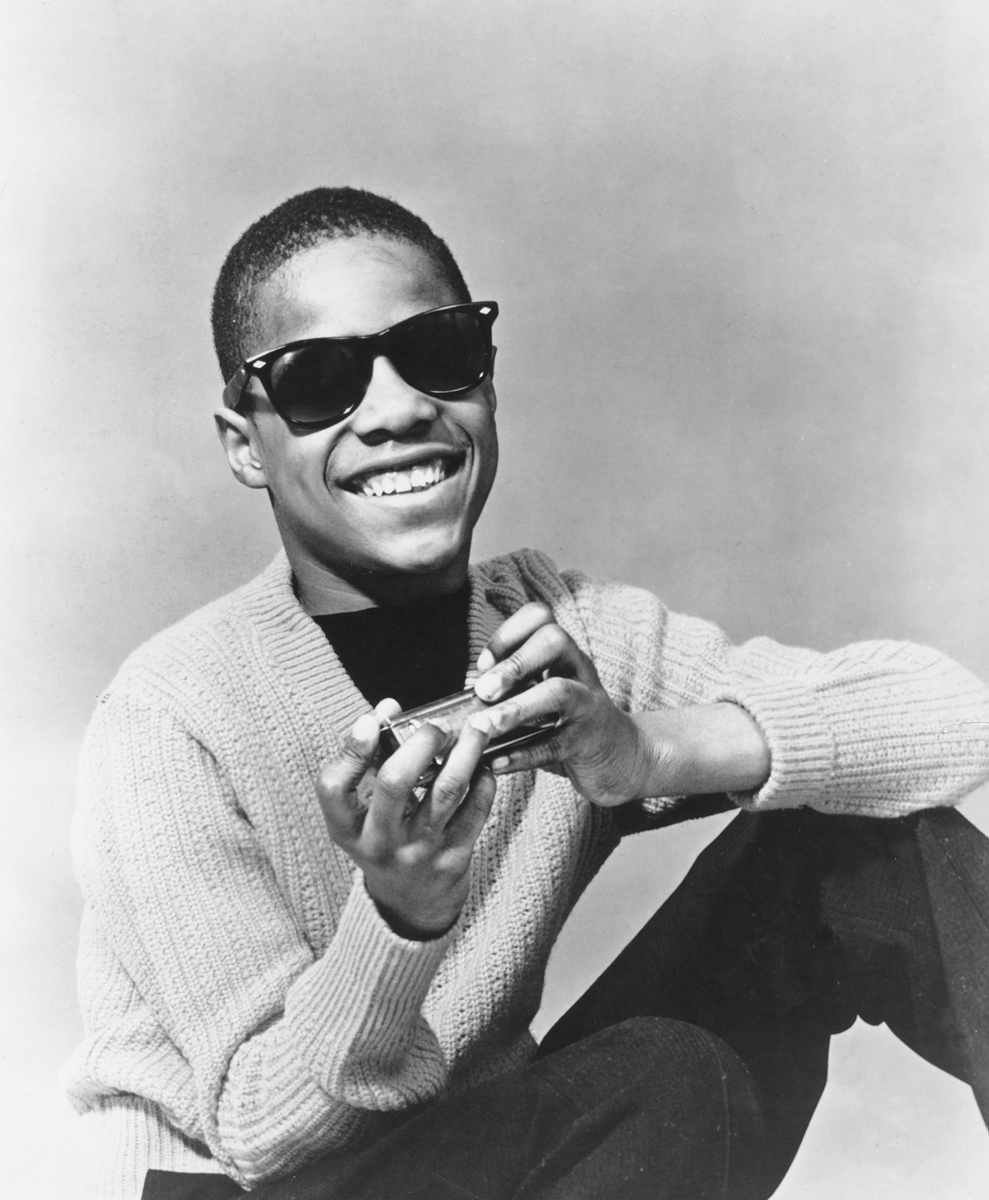A young Stevie Wonder posed with his harmonica circa 1960. At 11 years old, Stevie began his singing career and auditioned at Motown, where Berry Gordy, the founder of Motown, signed him. While Motown producer Clarence Paul gave Wonder the nickname 