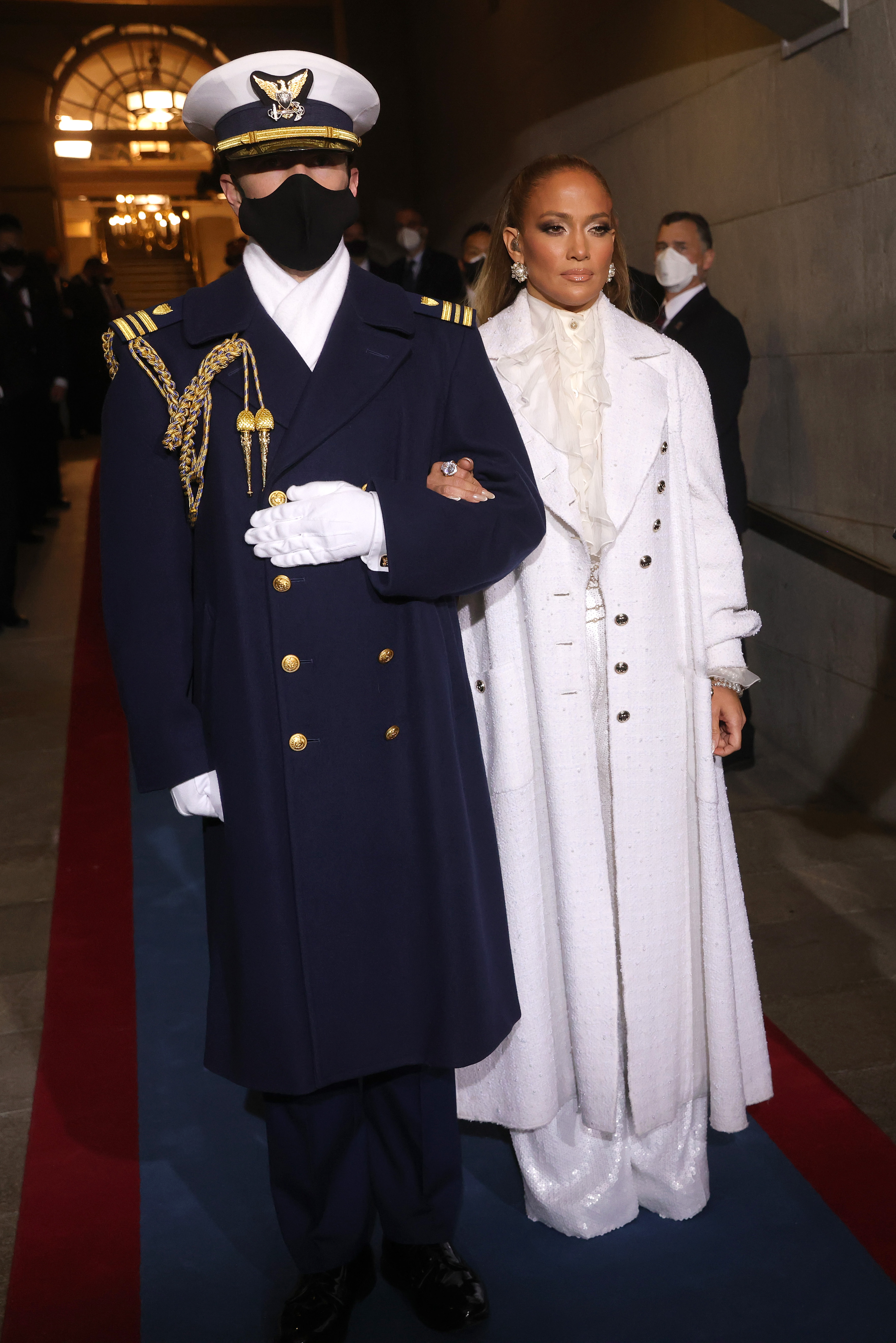 Jennifer Lopez is escorted to the inauguration of U.S. President-elect Joe Biden on the West Front of the U.S. Capitol on Jan. 20, 2021, in Washington, DC. Jennifer Lopez is escorted to the inauguration of U.S. President-elect Joe Biden on the West Front of the U.S. Capitol on Jan. 20, 2021, in Washington, DC.