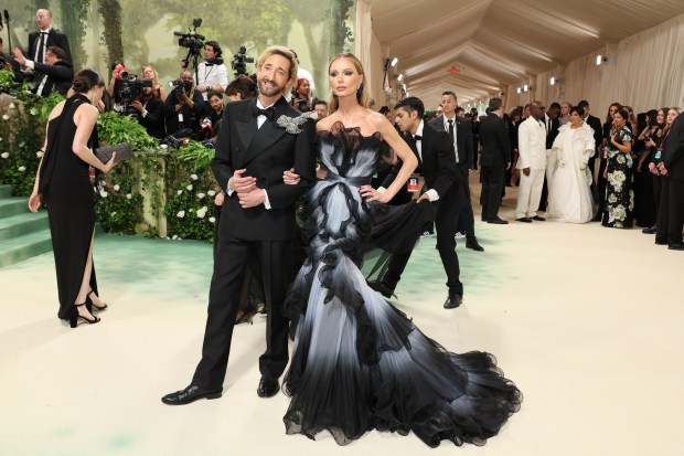 Adrien Brody and Georgina Chapman attend The 2024 Met Gala Celebrating "Sleeping Beauties: Reawakening Fashion" at The Metropolitan Museum of Art on May 06, 2024 in New York City.
