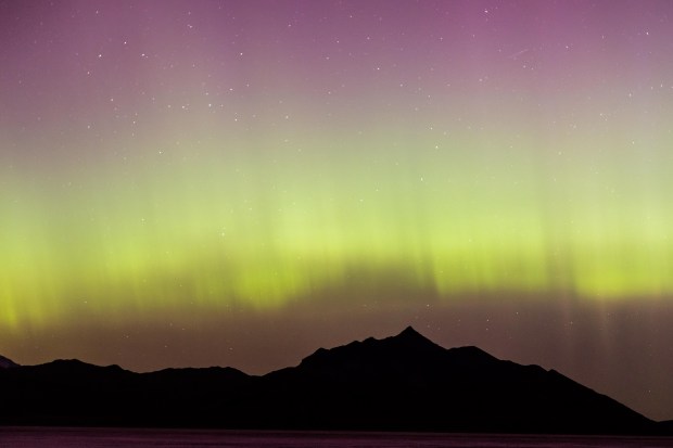 WENDOVER, UTAH - MAY 10: A geomagnetic storm lights up the night sky above the Bonneville Salt Flats on May 10, 2024 in Wendover, Utah. Places as far south as Alabama and parts of Northern California were expected to see the aurora borealis, also known as the northern lights from a powerful geomagnetic storm that reached Earth. (Photo by Blake Benard/Getty Images)