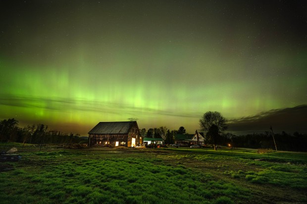 MERCER, MAINE - MAY 11, 2024 The northern lights fill the sky with green ribbons of electrical charged particles over the barn and pastures at Greaney's Turkey Farm in Mercer, Maine on May 11, 2024. The aurora borealis, commonly referred to as the northern lights, are electrically charged particles that are interacting with gases in outer space. This recent display was the strongest seen since 2003 rating a G5 on the geomagnetic scale. (Photo by Michael Seamans/Getty Images)