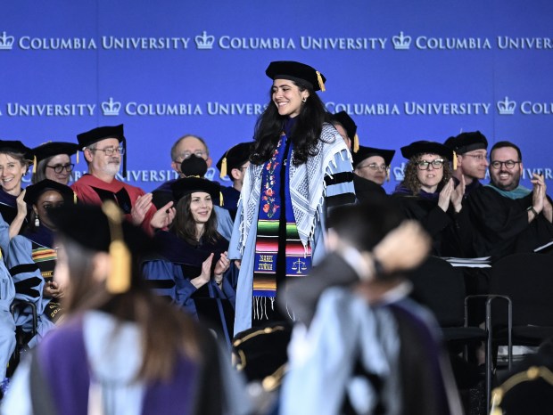 Alumni of Columbia law school carry out silent pro-Palestinian protest with keffiyehs and banners, calling for ceasefire during their graduation ceremony in New York, United States on May 13, 2024. (Fatih Akta/Anadolu via Getty Images)