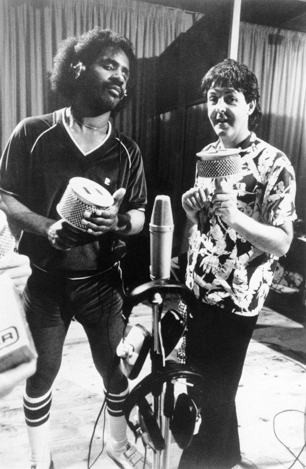 (Original Caption) Paul McCartney fans can't wait until his latest album, Tug of War, is released in late April. The first single from the album, "Ebony and Ivory," will be released this week, teaming McCartney with Stevie Wonder (left). Wonder and McCartney are shown as they recorded the album last year in a series of recordings on the Carribean Island of Montserrat.