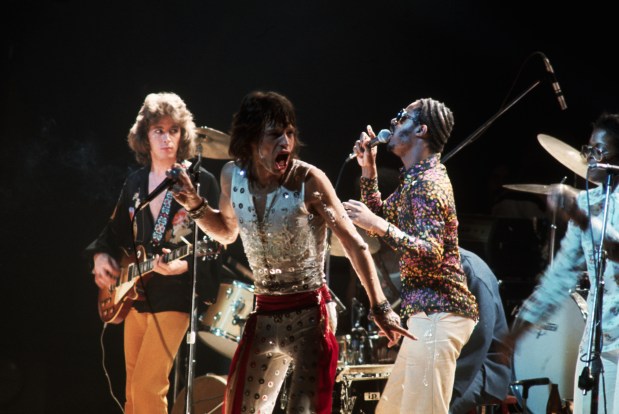 Mick Taylor (L) and Mick Jagger (C) of the Rolling Stones perform with Stevie Wonder (R) at Madison Square Garden circa 1972. The concert was the final performance of the group's 30-city, 3-month tour of the United States and Canada.