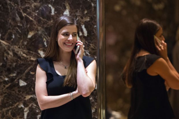US President-elect Donald Trump's transition liaison Madeline Westerhout talks on the phone in the lobby of Trump Tower, November 30, 2016 in New York. / AFP / Bryan R. Smith (Photo credit should read BRYAN R. SMITH/AFP via Getty Images)