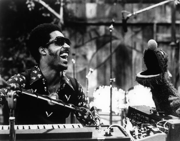 UNITED STATES - APRIL 28: USA Photo of Stevie WONDER, Stevie Wonder appears on Sesame Street with S.S. character Grover to perform Superstitious and a Sesame Street Jam. B&W ! (Photo by Echoes/Redferns)