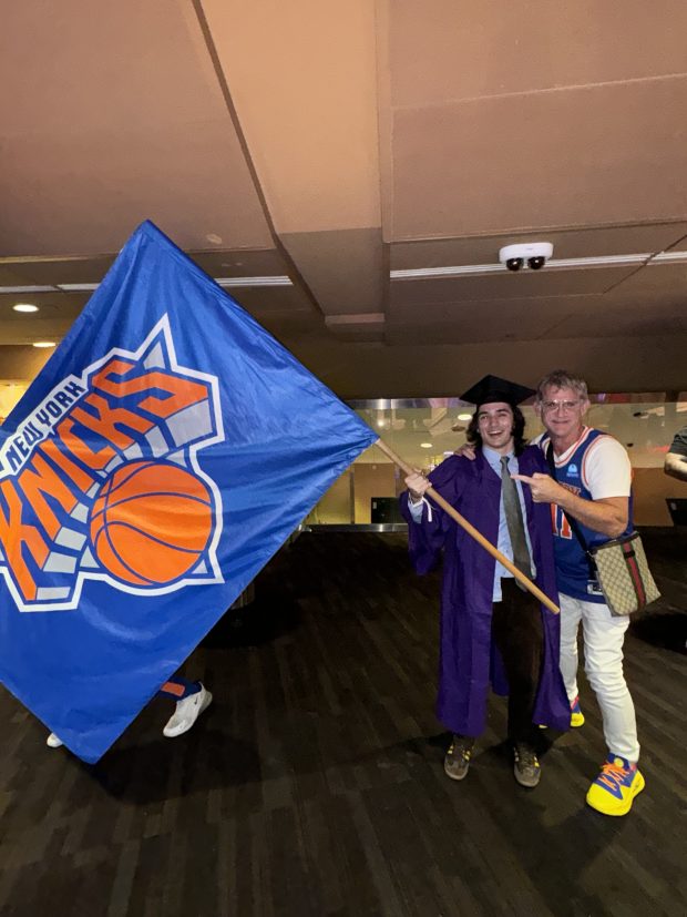 Knicks fan Rafael Nadal (l.) waving Knicks flag during Tuesday's Game 6. (Photo Courtesy of Victoria Nadal).