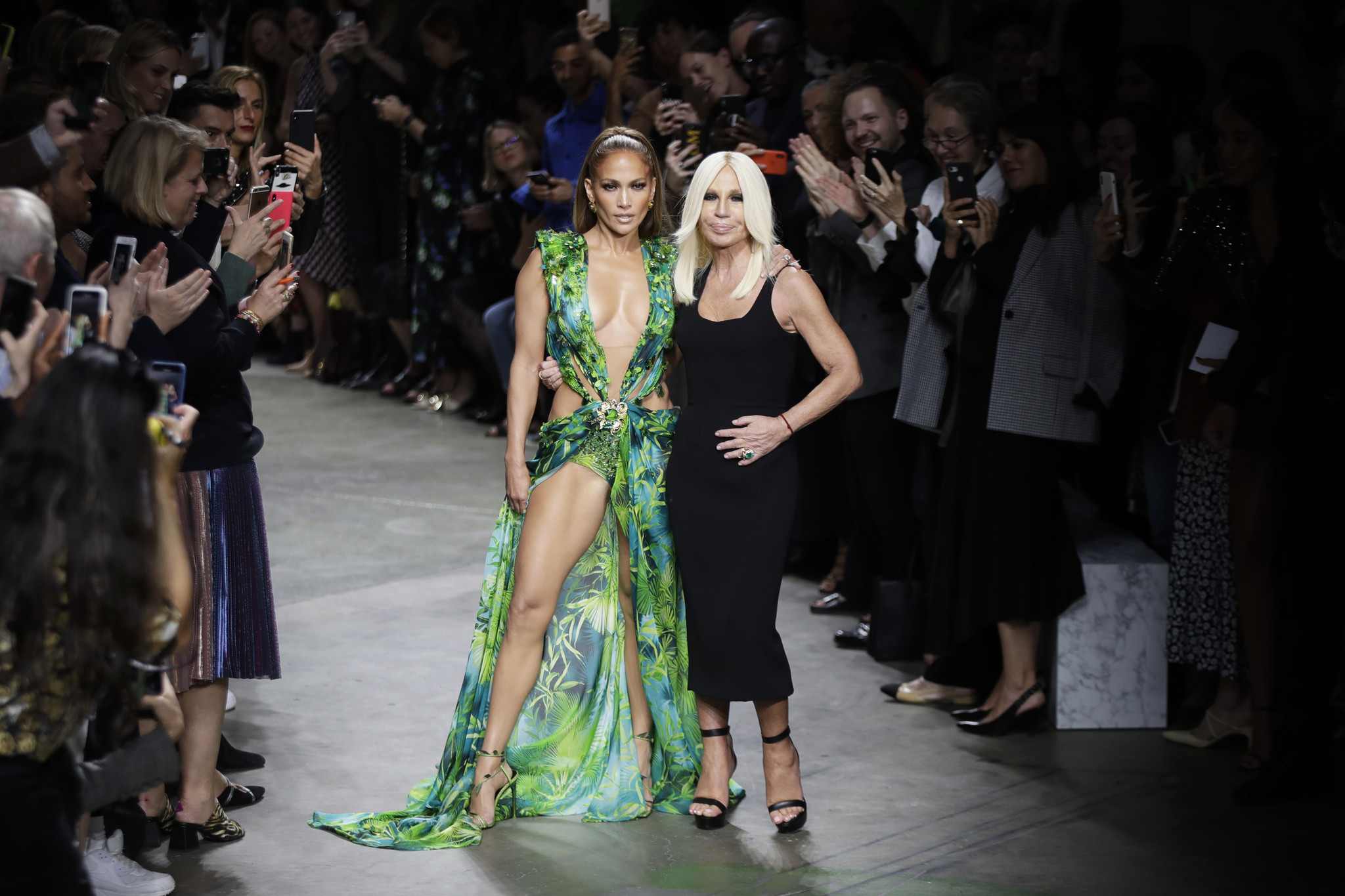 Jennifer Lopez threw things all the way back to 2000 on Sept. 20, 2019 when she closed out the Versace spring/summer 2020 show during Milan Fashion Week in Italy. Lopez, donning a dress strikingly similar to the famed green jungle-print dress she wore to the 2000 Grammy Awards, sashayed out onto the runway, prompting a flurry of photos. Jennifer Lopez threw things all the way back to 2000 on Sept. 20, 2019 when she closed out the Versace spring/summer 2020 show during Milan Fashion Week in Italy. Lopez, donning a dress strikingly similar to the famed green jungle-print dress she wore to the 2000 Grammy Awards, sashayed out onto the runway, prompting a flurry of photos.