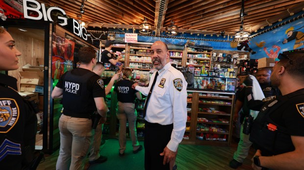 New York City Sheriff Anthony Miranda (White Shirt) is pictured conducting a raid on the New City Smoke Shop on Church Street and Park Place in downtown Manhattan, Tuesday, May 7, 2024. The raid was announced during Mayor Adams's in-person Press Conference at City Hall. During the press conference, the mayor spoke with New York City Sheriff Anthony Miranda about the raid on an unlicensed marijuana shop and is one of the first to shut down and lock the doors of illegal pot stores plaguing the city. (Luiz C. Ribeiro for NY Daily News)