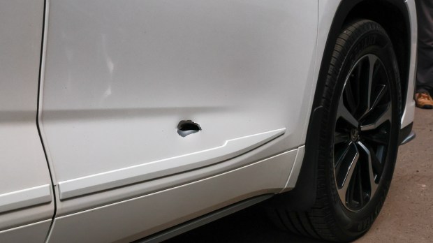 A bullet hole is seen on the Toyota Highlander of the Bronx driver Eufelix Jiminian after a passenger opened fire at his car at around 4 a.m. on May 3. Video footage from inside the car showed the driver, 26-year-old Eufelix Jiminian, jumping when the shots were fired from the right side of the passenger door. The passenger fired five shots before escaping. (Luiz C. Ribeiro for NY Daily News)