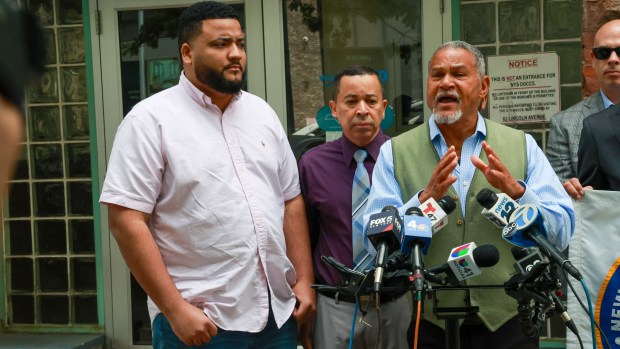 Bronx driver Eufelix Jiminian is pictured at a press conference in the Bronx with Fernando Mateo (R) and Antonio Cabrera, President of the New York State Federation of Taxi Drivers. Mr. Jiliminian described his ordeal and fears in Spanish after a passenger opened fire at his Toyota Highlander at around 4 a.m. on May 3. Video footage from inside the car showed the driver, 26-year-old Eufelix Jiminian, jumping when the shots were fired from the right side of the passenger door. The passenger fired five shots before escaping. (Luiz C. Ribeiro for NY Daily News)