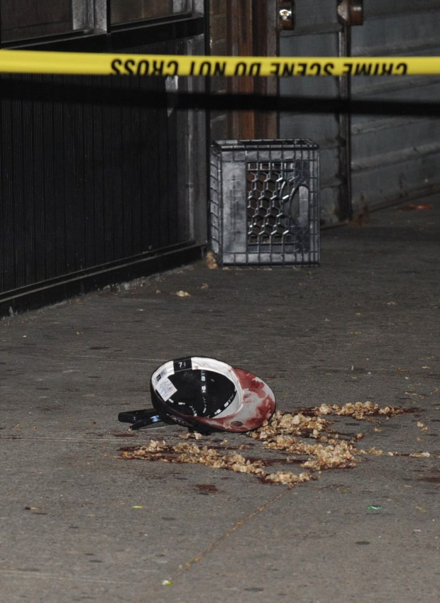 A bloodied cap is seen where a man was fatally shot to his head on the corner of East 187 street and Beaumont Ave. on May 8, 2024. (Sam Costanza for the New York Daily News)