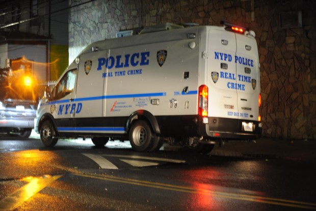 An NYPD Crime Scene unit on the scene where a child was shot on Wednesday, May 25, 2024, in front of 106-22 160 street, NYCHA's South Jamaica Houses. (Sam Costanza for the New York Daily News)